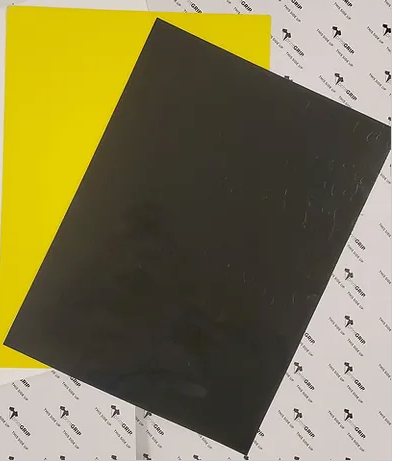 PrintGRIP Pallet Adhesive - photo of black and yellow sheet together